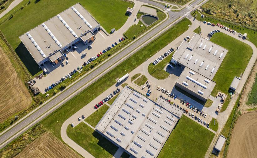Aerial view of industrial and investment areas in Dzierżoniów, showing warehouses and factories